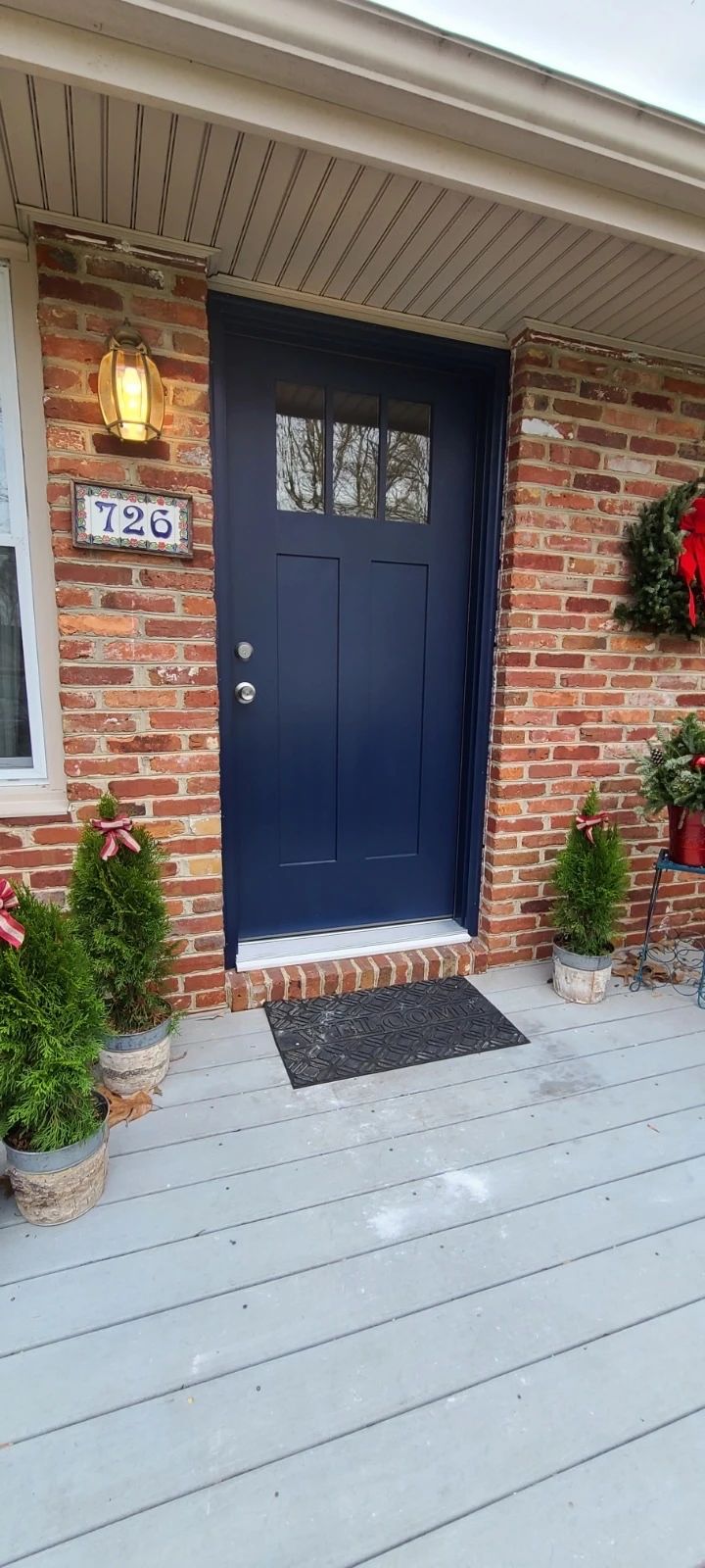 Painted wood front entry door.