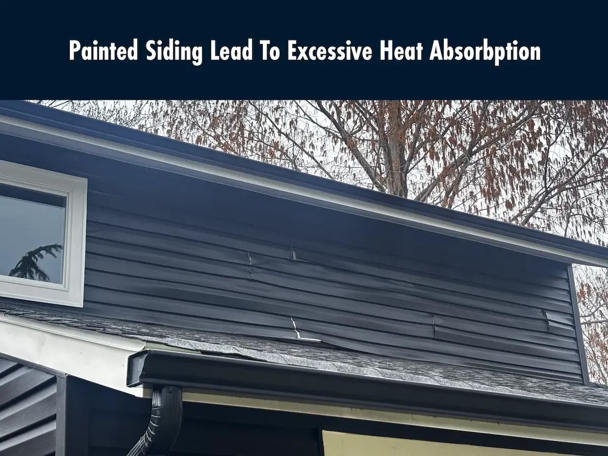 Warped vinyl siding caused by dark paint trapping heat on older siding without UV protection