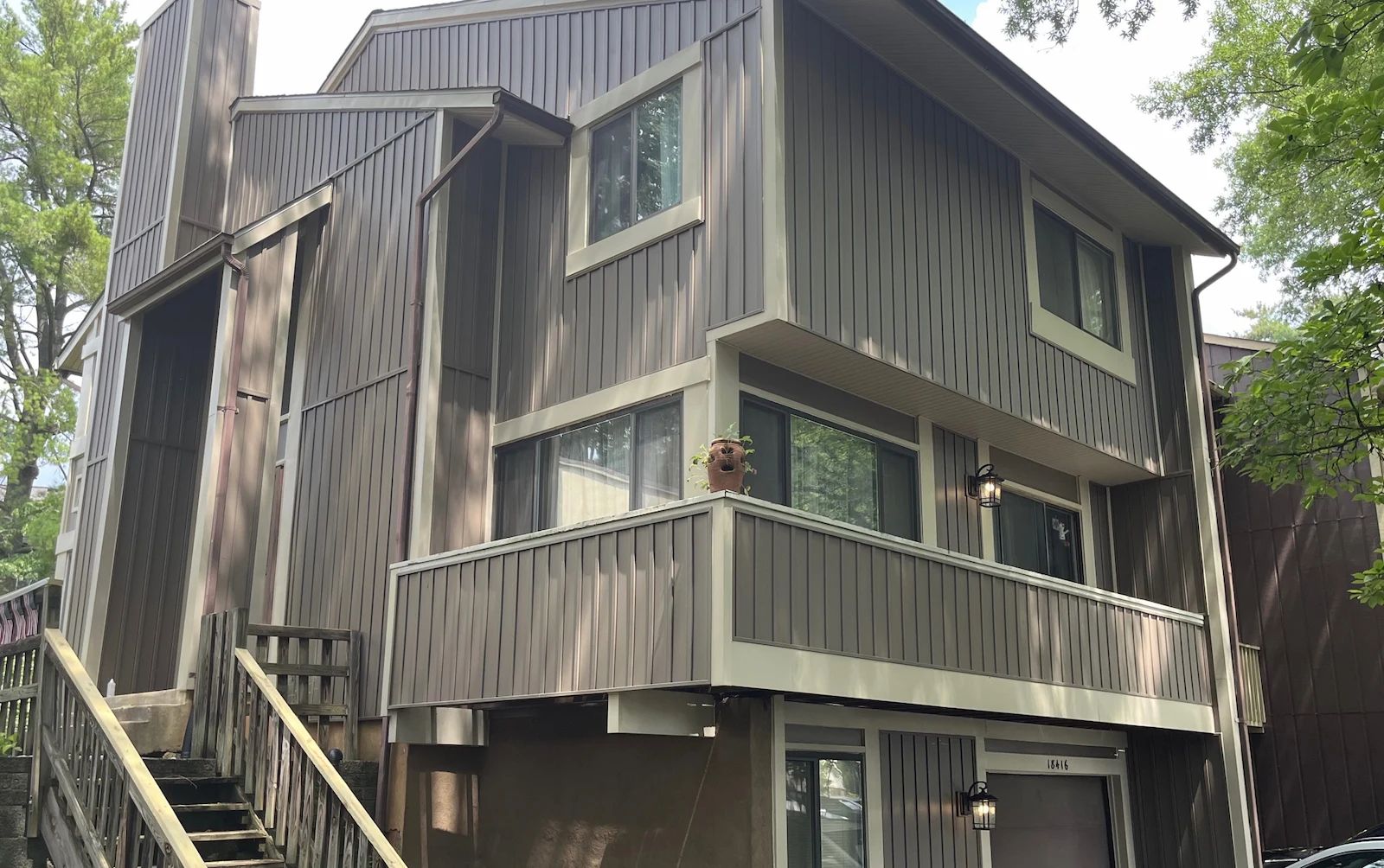 Full house photo of vinyl board and batten siding. 